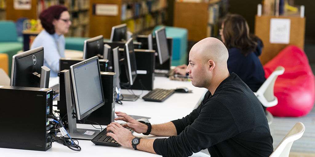 man working at a computer in an lab environment