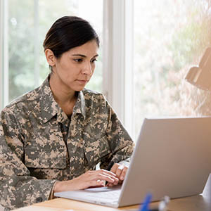 female soldier at computer