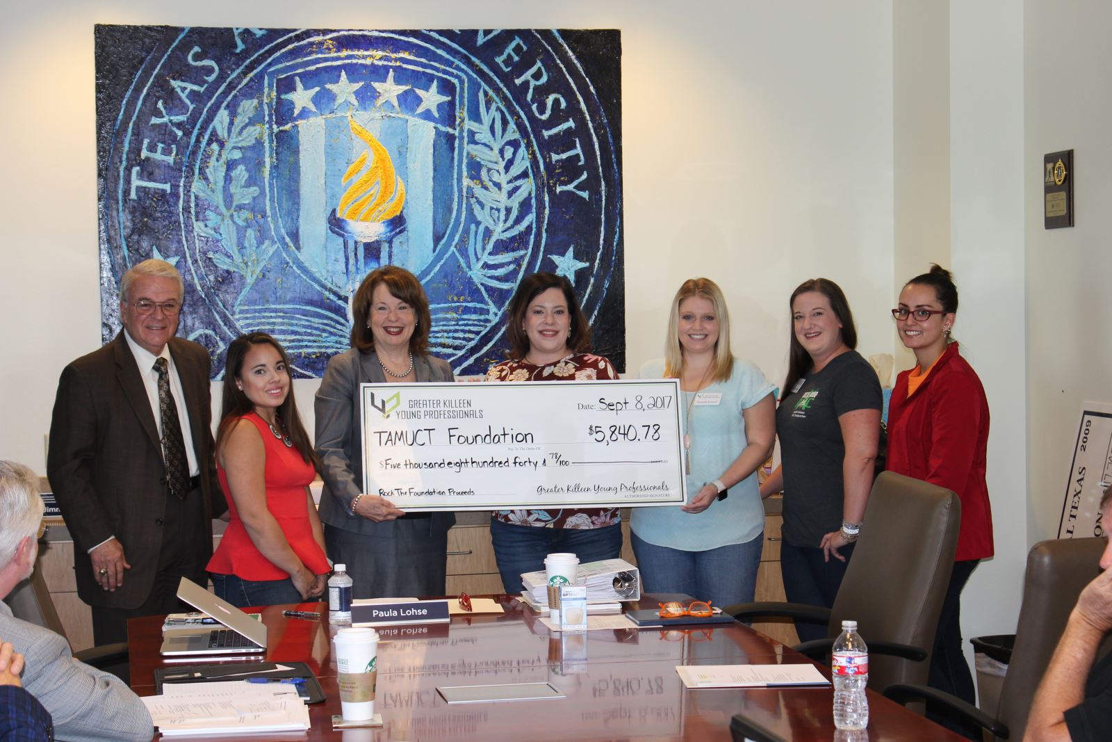 A&M-Central Texas Foundation members receive a donation check from the Greater Killeen Young Professionals Organization  