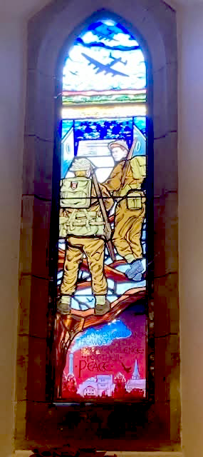 historic stained glass and a more recent addition paying tribute to those WWII veterans