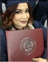 Picture of Erika Gil graduate student during her graduation ceremony
