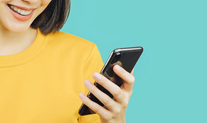 woman holding cell phone