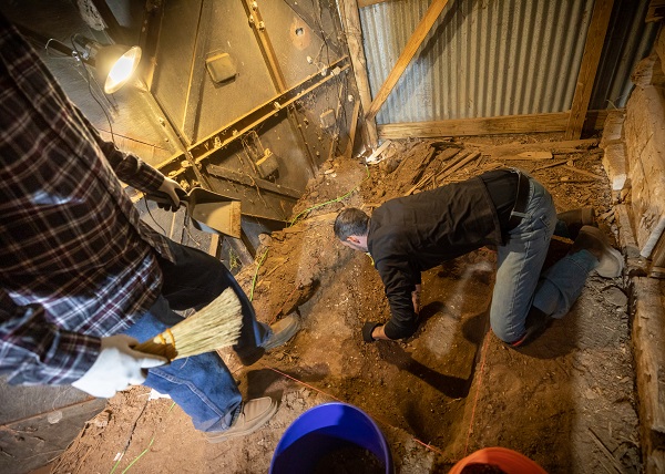 Two students work at a unit inside of the Priddy Cabin