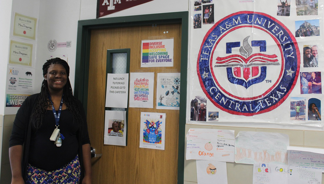 >Bianca Chapman MEd. stands in front of her classroom door