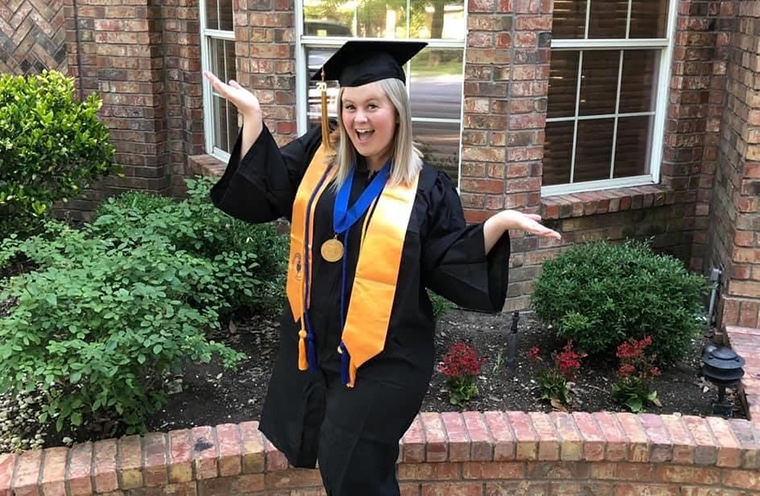 Rachel Edelbrock poses in her Temple College graduation attire