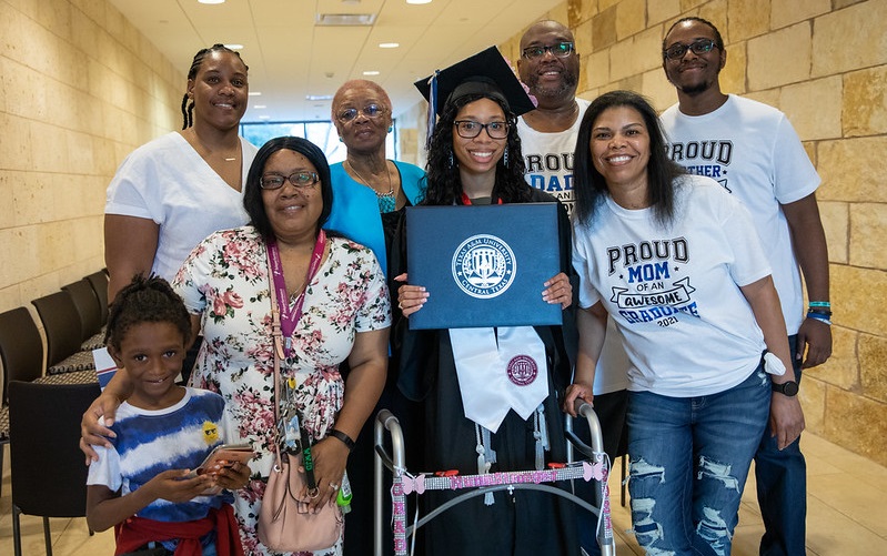 Valyncia Nunn  takes a picture with her family after graduating from Texas A&M-University Central Texas on December 10