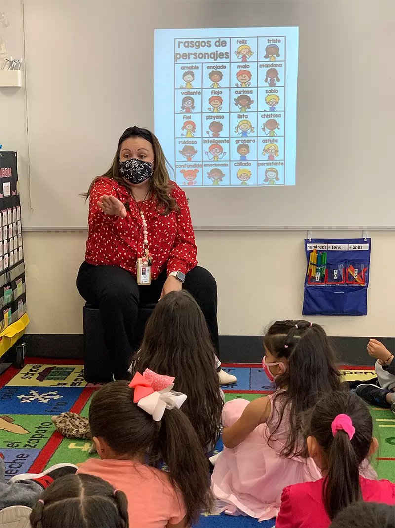 Lidia Valentin stands in front of her classroom