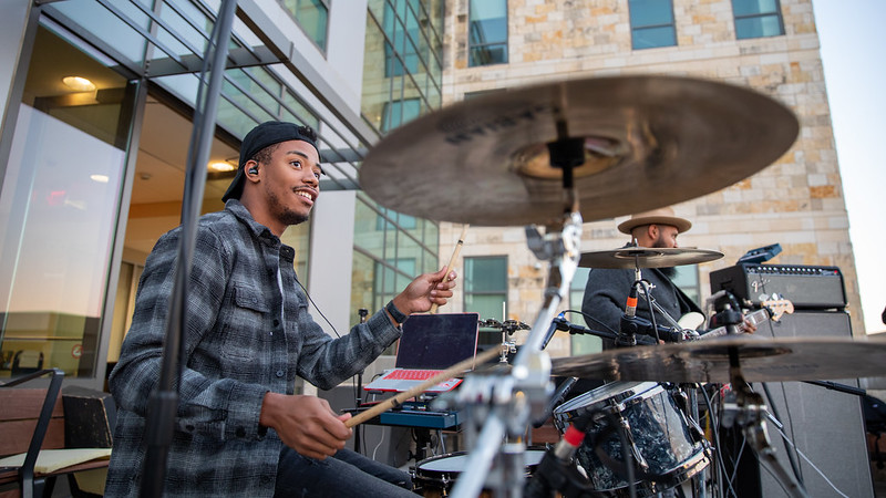 A man plays the drums