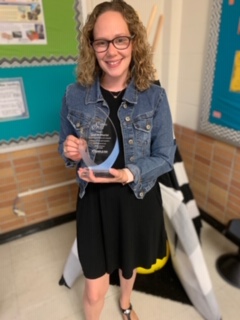 Taryn McWhorter holds her Rookie of the Year award