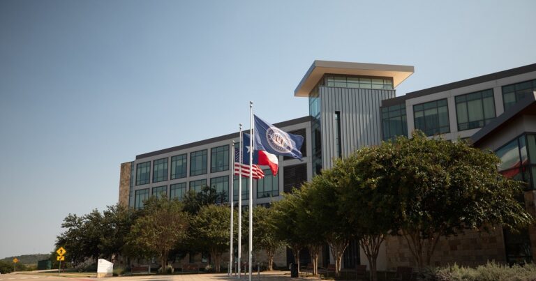 The flags of the United States of America, the state of Texas, and Texas A&M University-Central Texas wave during the middle of the day in front of the Founders Hall at Texas A&M University-Central Texas