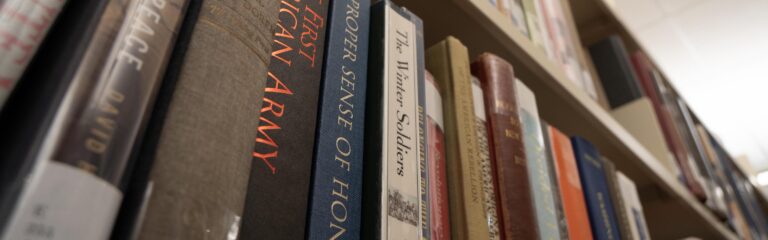 Many books on a library shelf