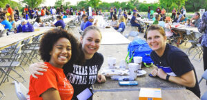 Three female students smiling at the camera in celebration of Warrior Week at Texas A&M University - Central Texas