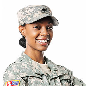 Female African American soldier in army camouflage uniform or ACU and patrol cap.