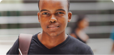 A male student smirking at the camera
