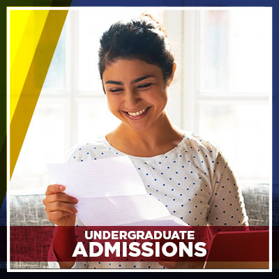 A woman looking at a piece of paper, smiling