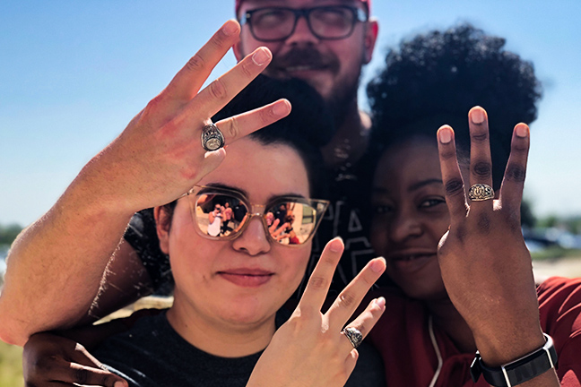 3 people with class rings