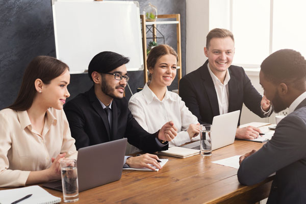 Young modern people in smart casual wear smiling