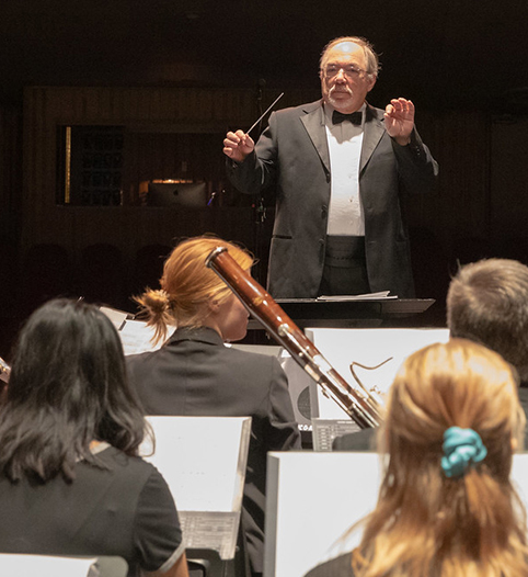 Conductor conducting a band