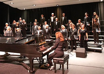 A chorale performing with a piano player