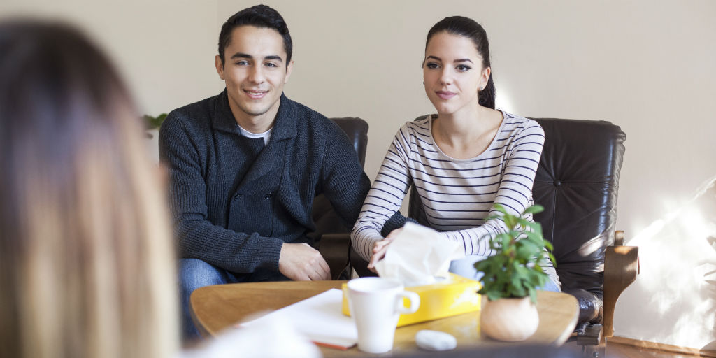 A couple sitting together in a therapy session