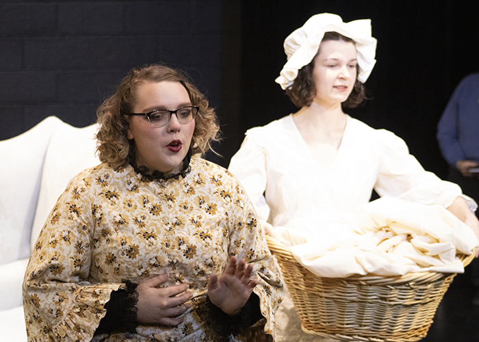 Two people in costume performing an opera