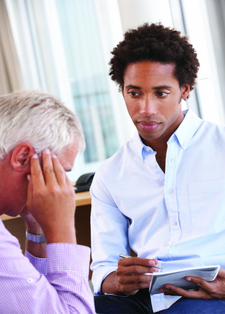 Social worker working with client