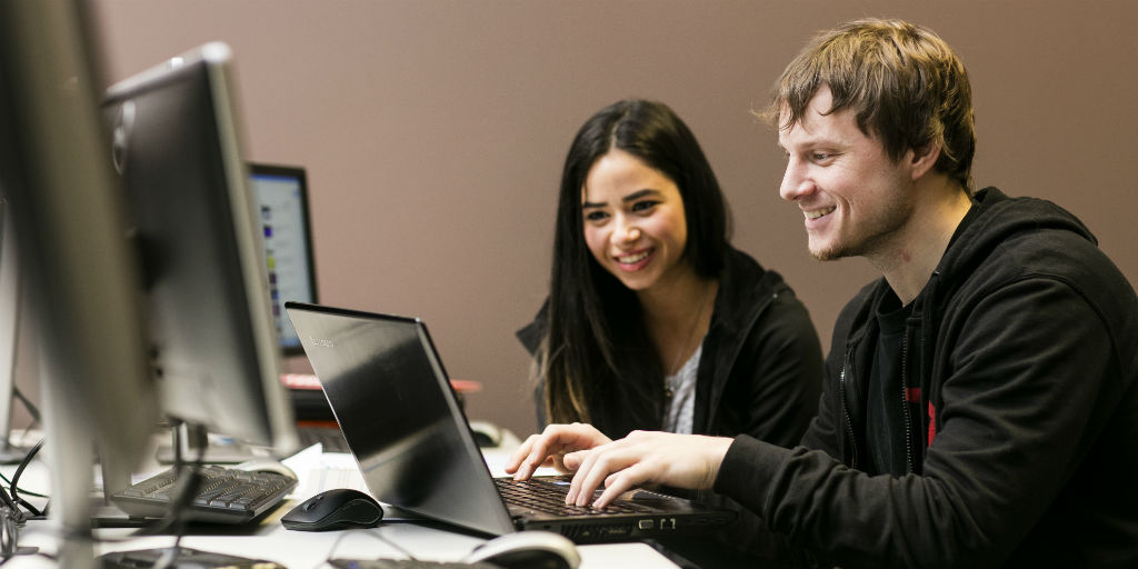 Two people at a computer