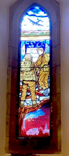 Historic stained glass and a more recent addition paying tribute to those WWII veterans