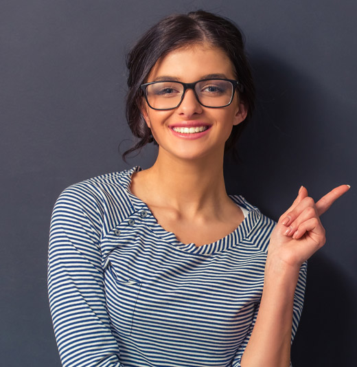 Woman pointing to her left.