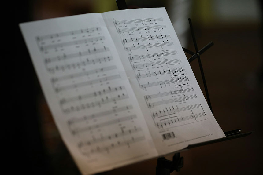 Photo of a libretto showing musical notes and words
