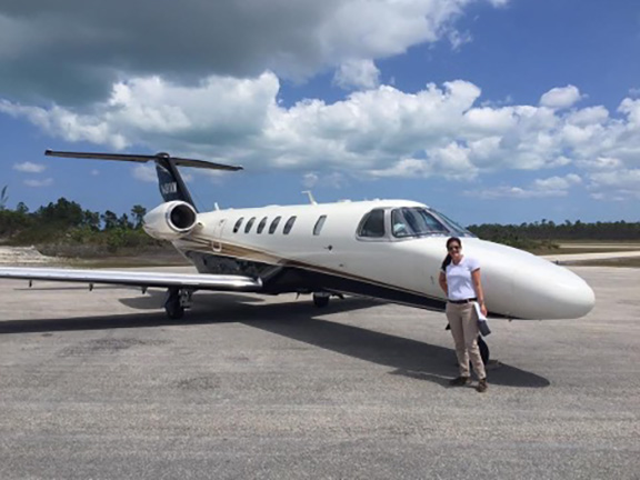 Rebecca Nicole Paker poses in front of a CJ4 jet. Parker is an assistant lecturer in the aviation program at Texas A&M University–Central Texas.
