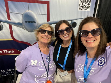 Rebecca Nicole Parker, right, and Dr. Angie Griffin, left, pose with a graduate from the A&M–Central Texas aviation program during a recruiting event in the summer of 2024 in Oshkosh, Wis
