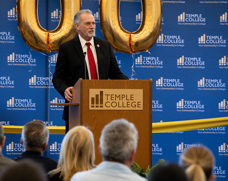 Richard M. Rhodes, Ph.D. speaks to the crowd at the ribbon cutting for the Temple Main building.