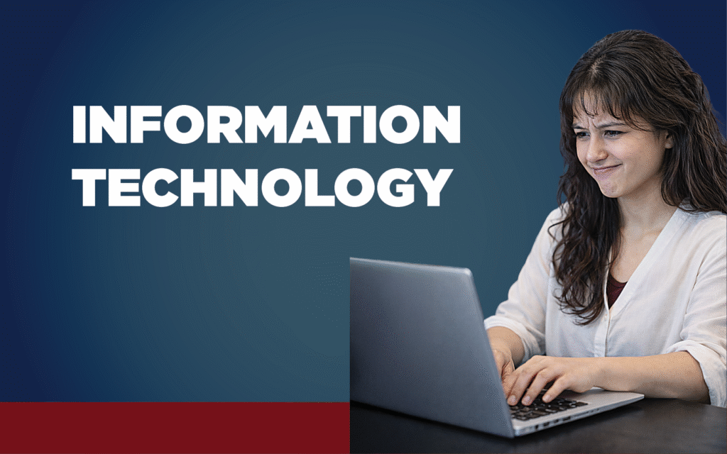 Woman with pained expression working on a computer with the words Information Technology displayed.