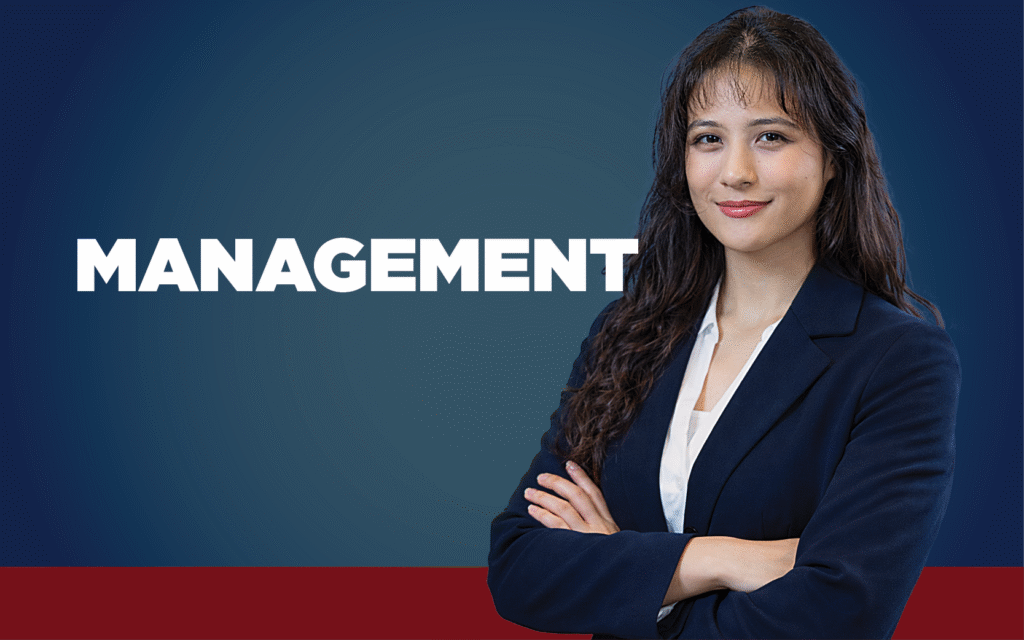 Woman in a blue blazer with her arms crossed in a power pose. The word Management is displayed.