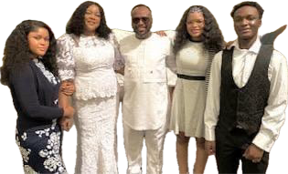 A man and wife with their three adult kids