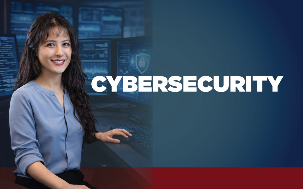 Long-haired woman in blue blouse sitting a computer. The word Cybersecurity is displayed.