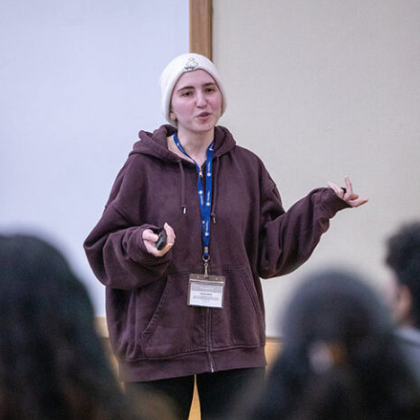 Student speaking at Research Symposium